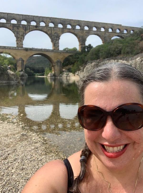 The author after her 49th swim of the project, in the River Gardon beneath the Pont du Gard near Nimes, France, in September 2022.